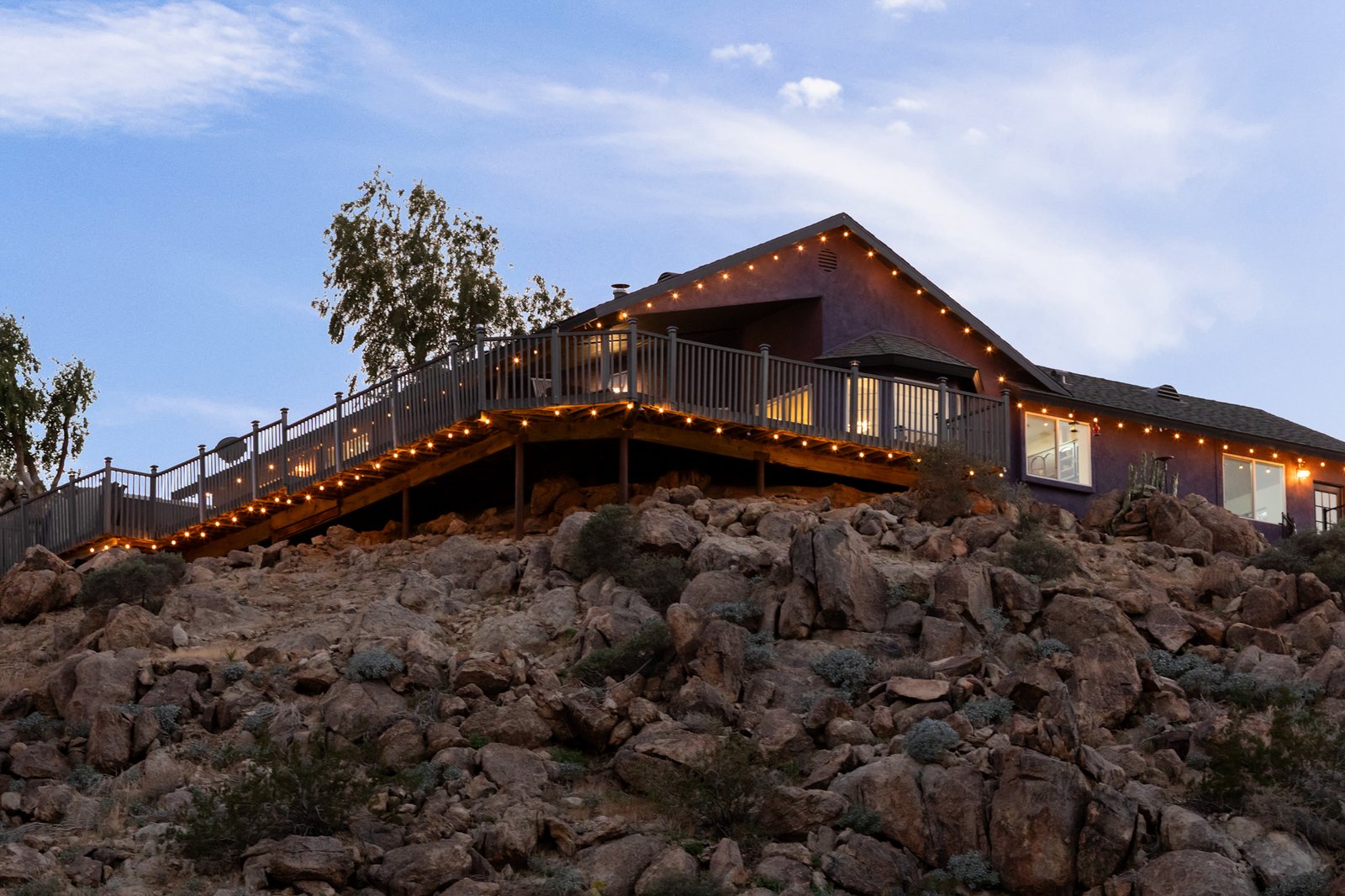 Desert Rose Ranch at dusk with the new wraparound deck